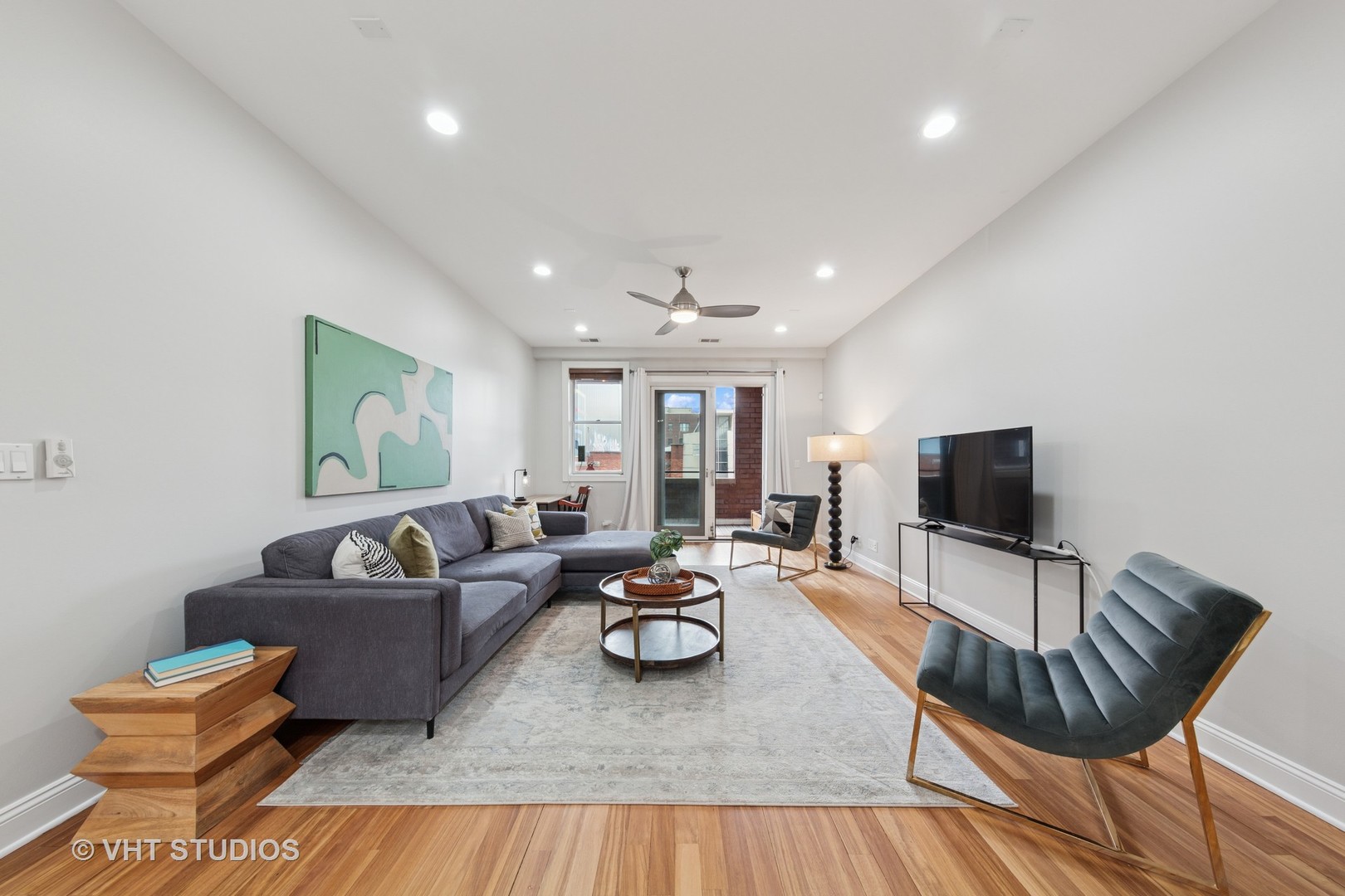 955 West Monroe Street, Unit 2C Chicago, IL 60607 - Photo 3 of 23 a living room with furniture and a flat screen tv