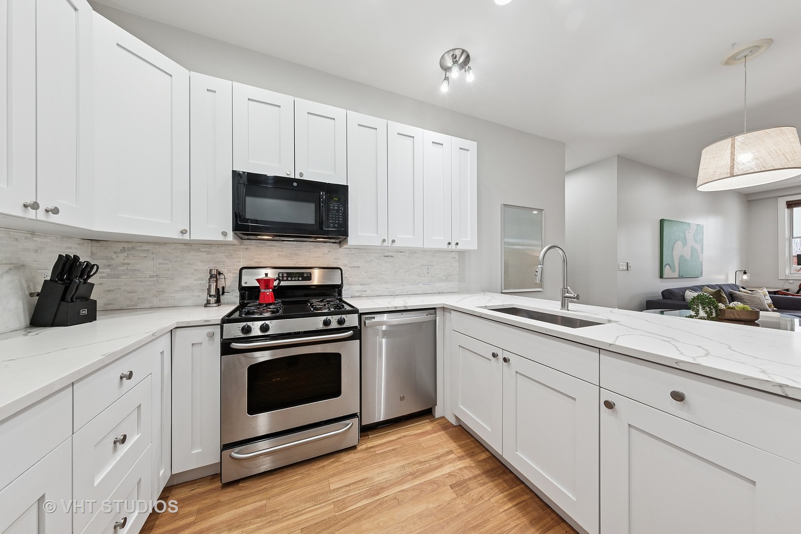 955 West Monroe Street, Unit 2C Chicago, IL 60607 - Photo 5 of 23 a kitchen with white cabinets and white appliances