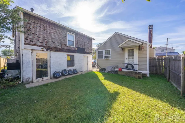 a kitchen with granite countertop stove top oven and sink