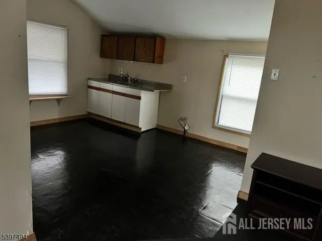a kitchen with stainless steel appliances a sink stove and microwave