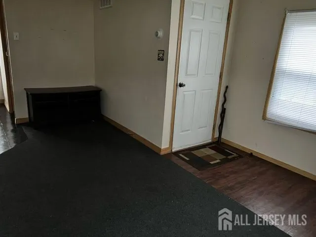 a view of a hallway with seating area