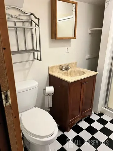 a bathroom with a glass door shower