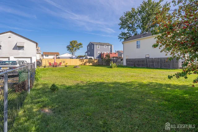 a view of a house with a yard porch and furniture
