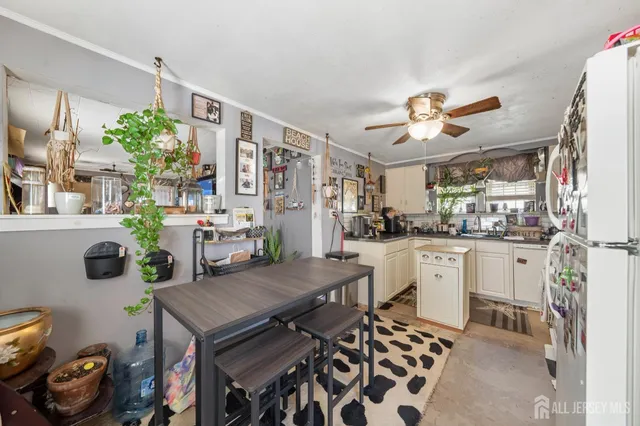 a kitchen with a table and chairs in it