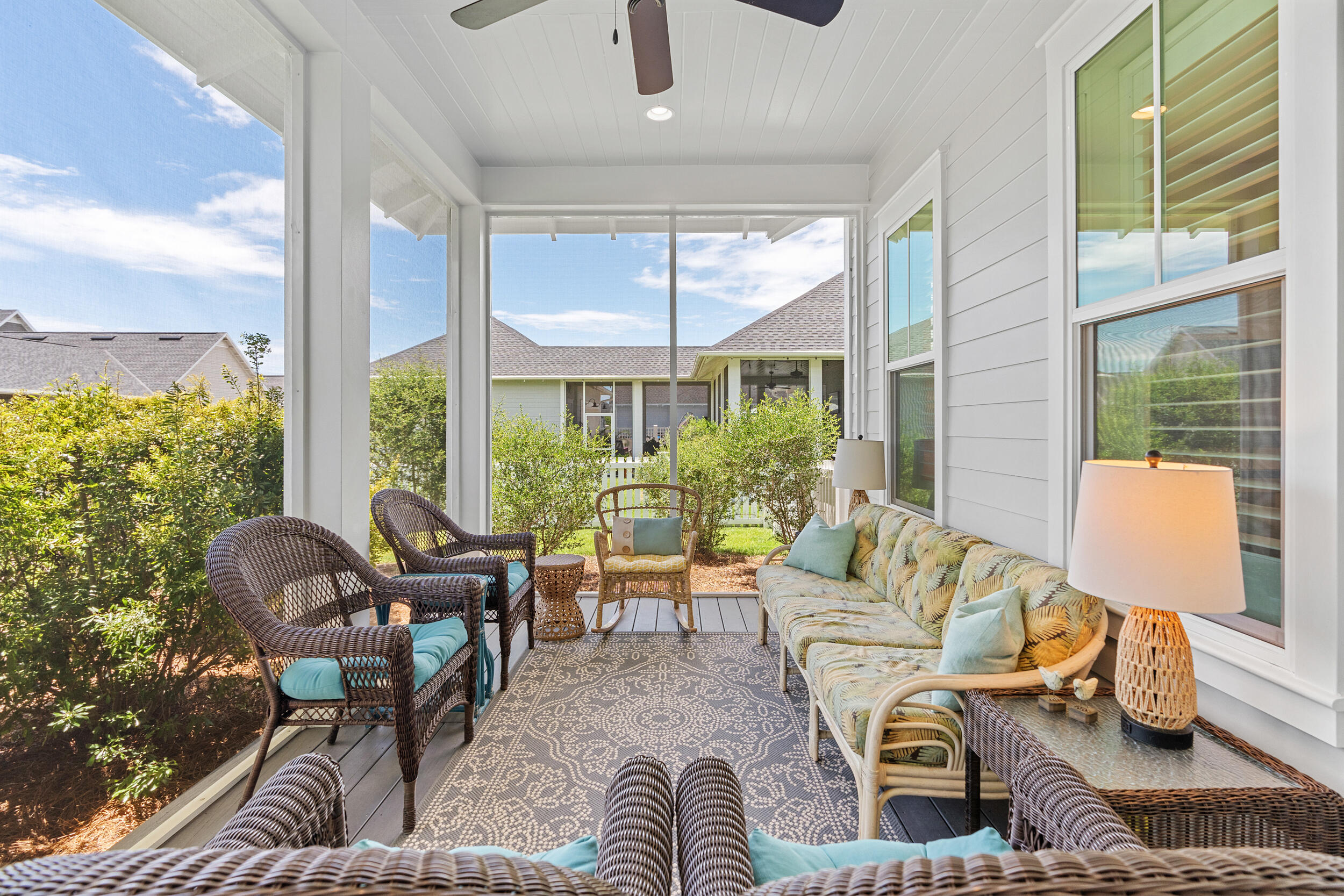 170 Sidecamp Road, Unit LOT 85 Watersound, FL 32461 - Photo 18 of 54 a living room with furniture and a floor to ceiling window