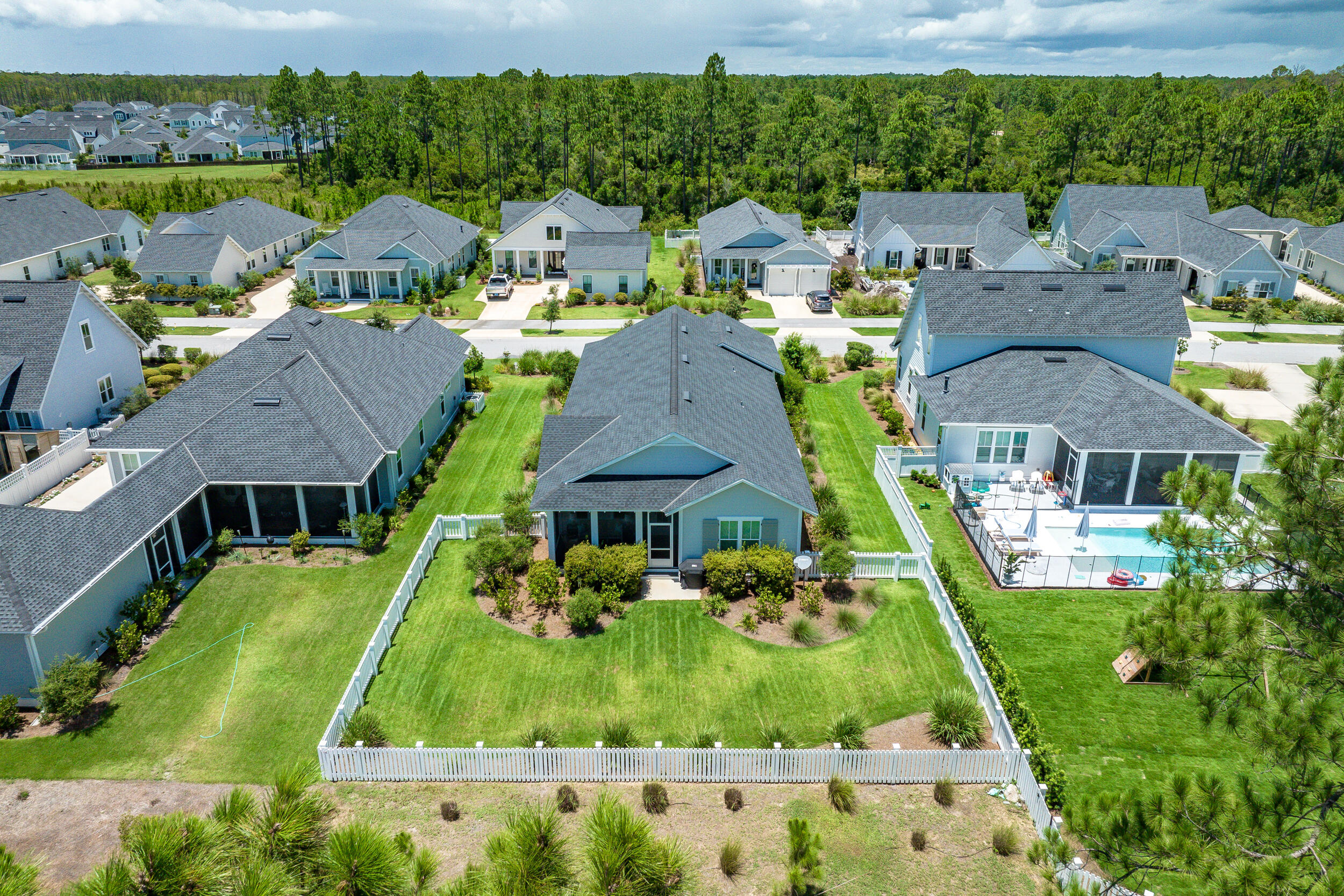 170 Sidecamp Road, Unit LOT 85 Watersound, FL 32461 - Photo 2 of 54 an aerial view of a house with a garden and lake view
