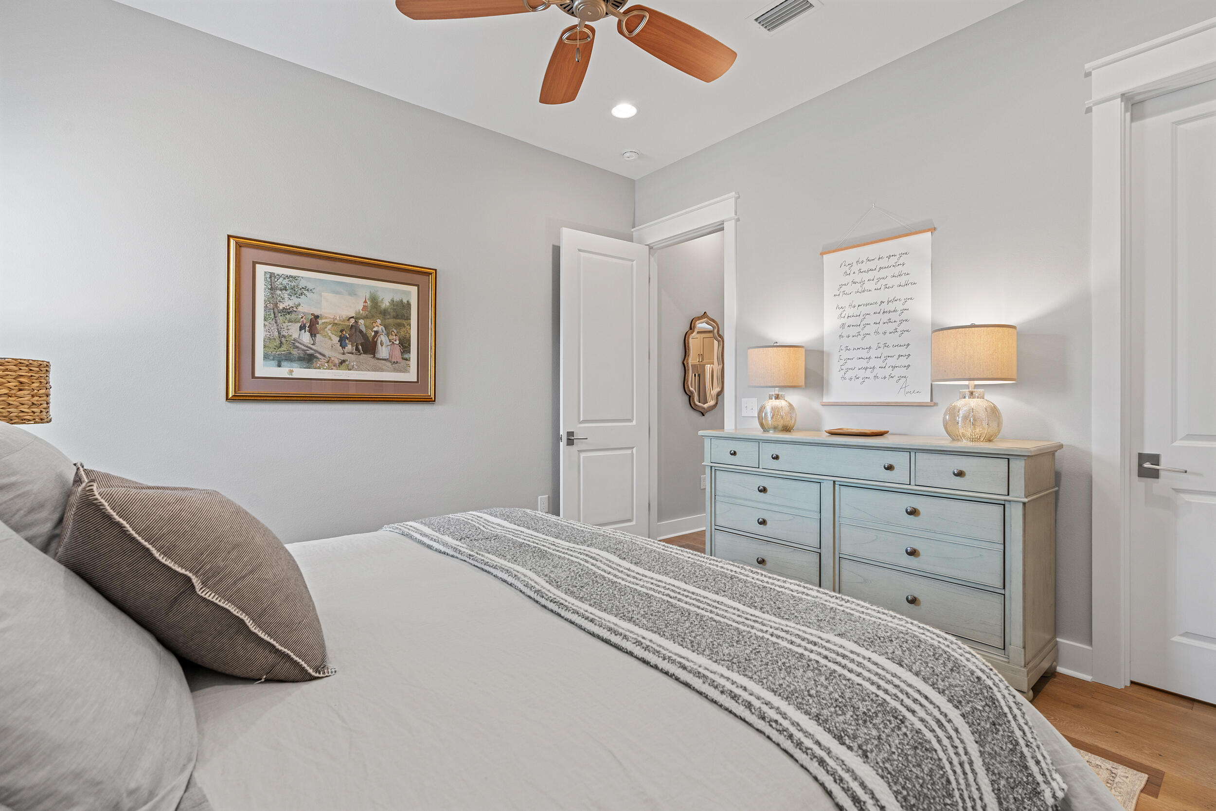 170 Sidecamp Road, Unit LOT 85 Watersound, FL 32461 - Photo 22 of 54 a bedroom with a bed and a chandelier