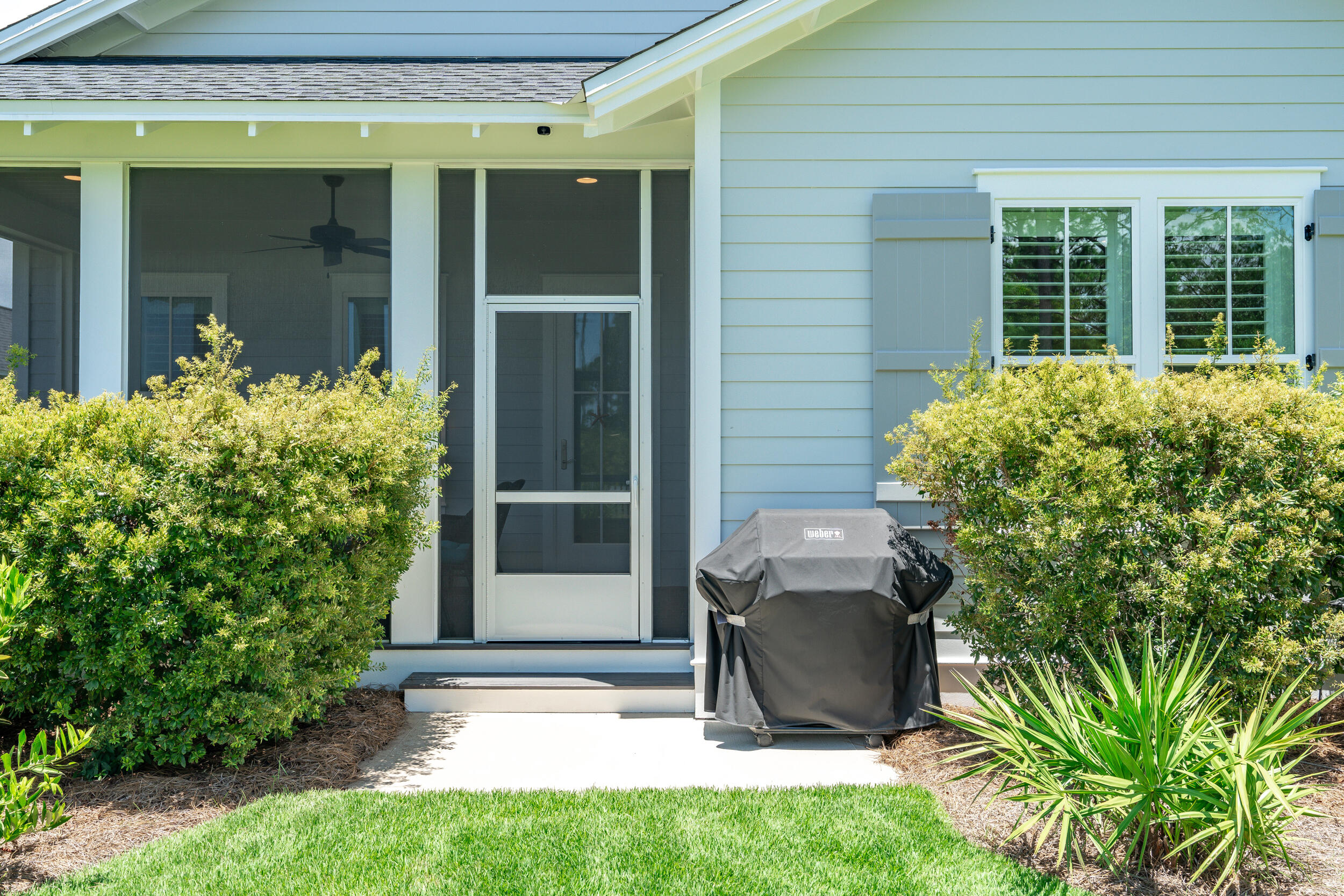 170 Sidecamp Road, Unit LOT 85 Watersound, FL 32461 - Photo 40 of 54 a view of a backyard with chair and potted plants