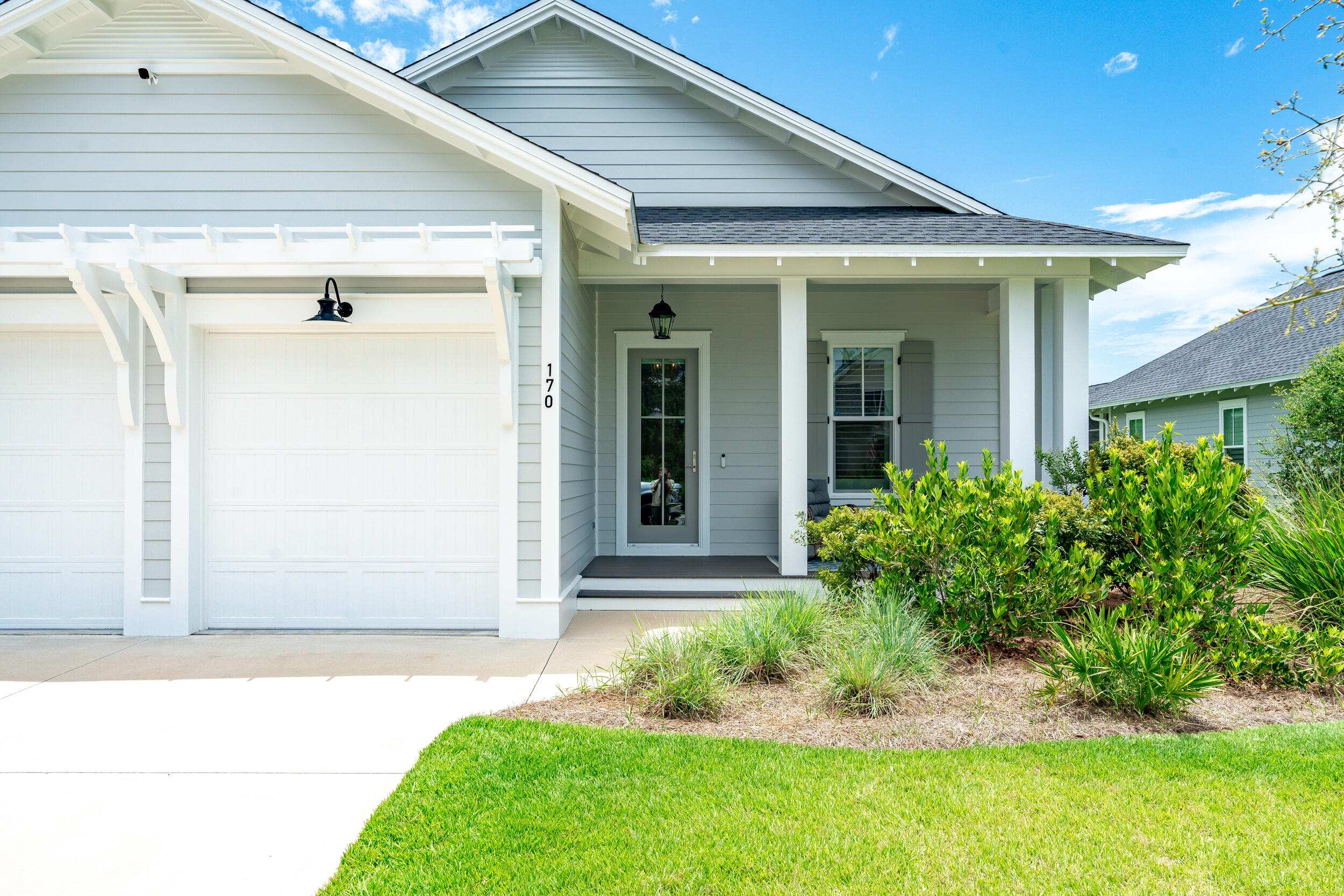170 Sidecamp Road, Unit LOT 85 Watersound, FL 32461 - Photo 41 of 54 a front view of a house with a yard and garage