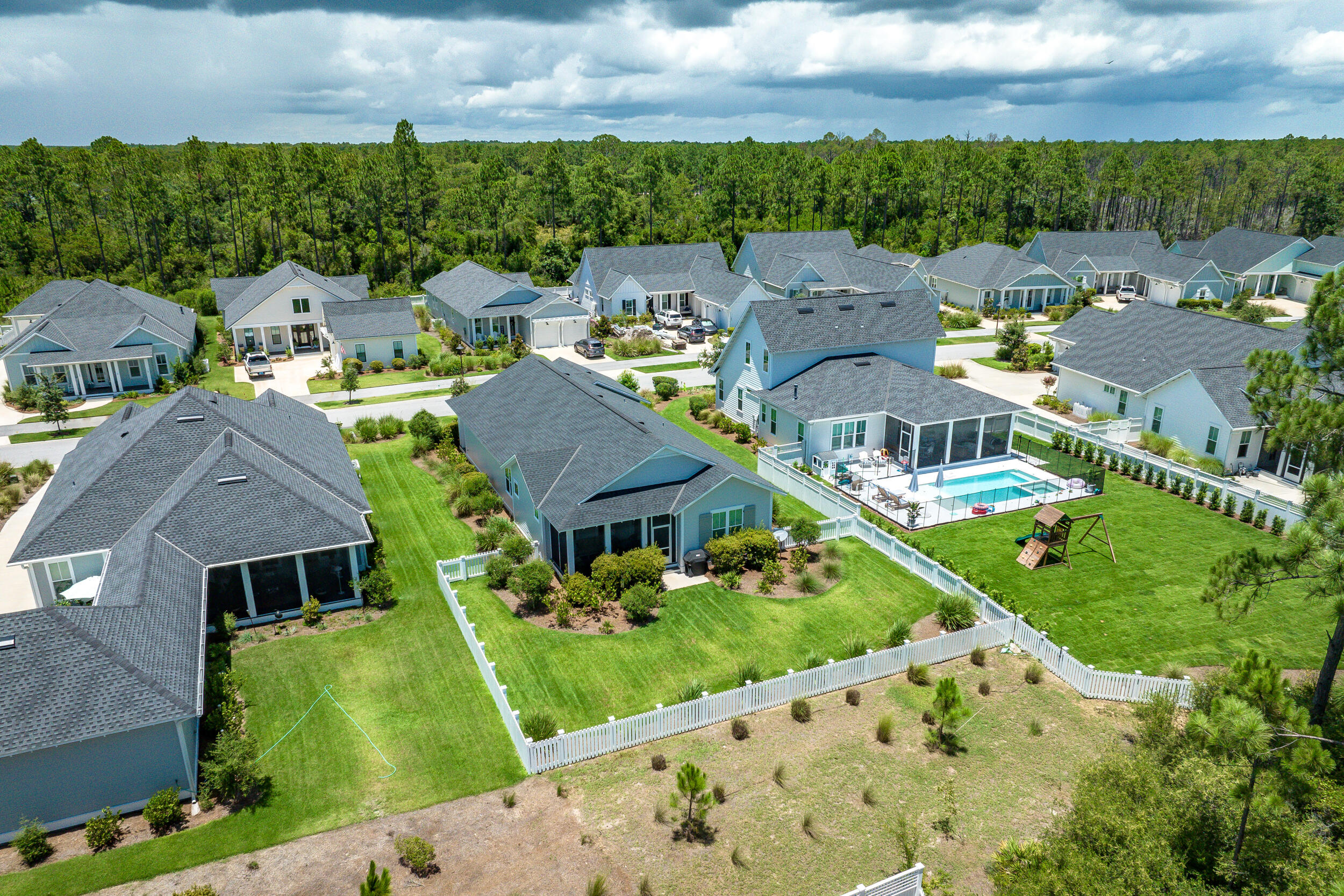 170 Sidecamp Road, Unit LOT 85 Watersound, FL 32461 - Photo 46 of 54 an aerial view of multiple houses with yard