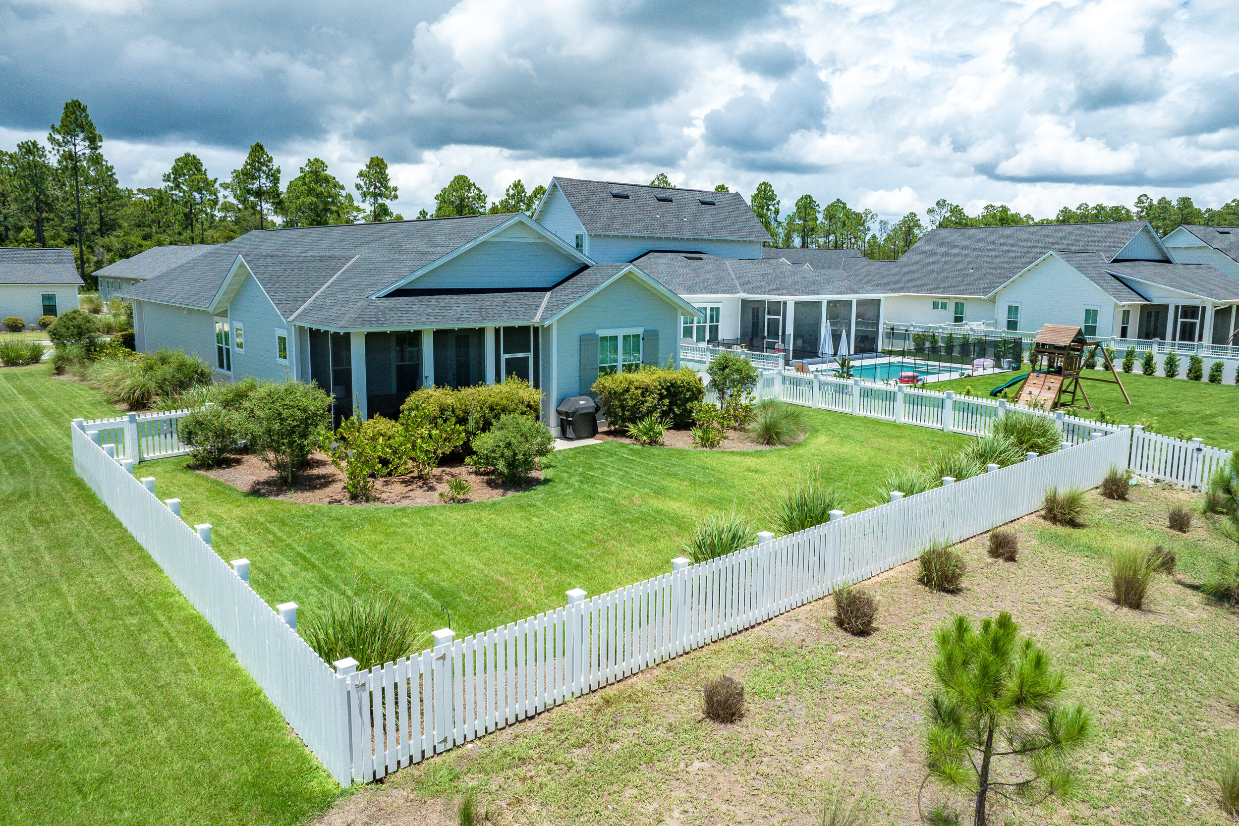 170 Sidecamp Road, Unit LOT 85 Watersound, FL 32461 - Photo 47 of 54 a front view of a house with garden
