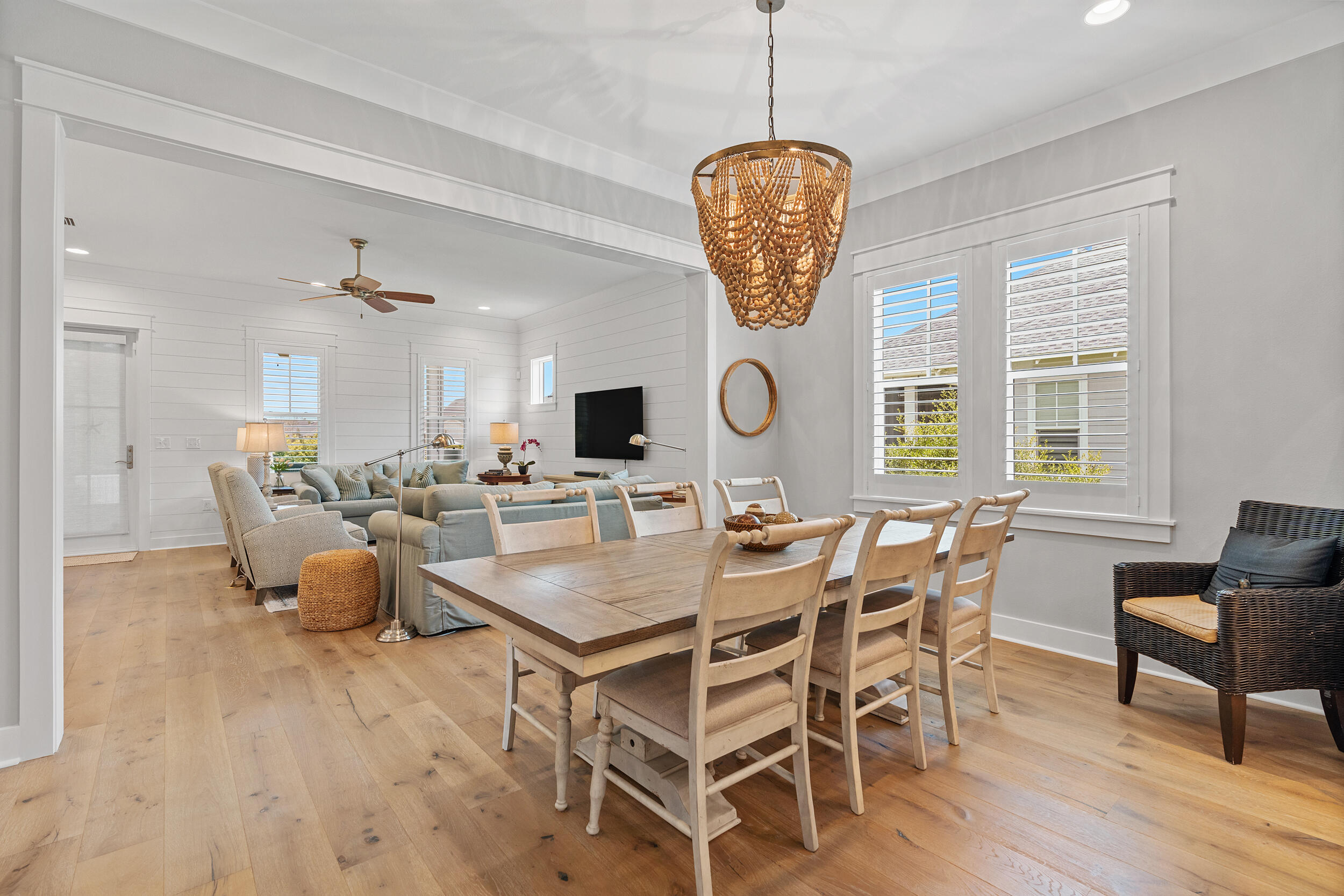 170 Sidecamp Road, Unit LOT 85 Watersound, FL 32461 - Photo 6 of 54 a view of a dining room and livingroom with furniture wooden floor a chandelier