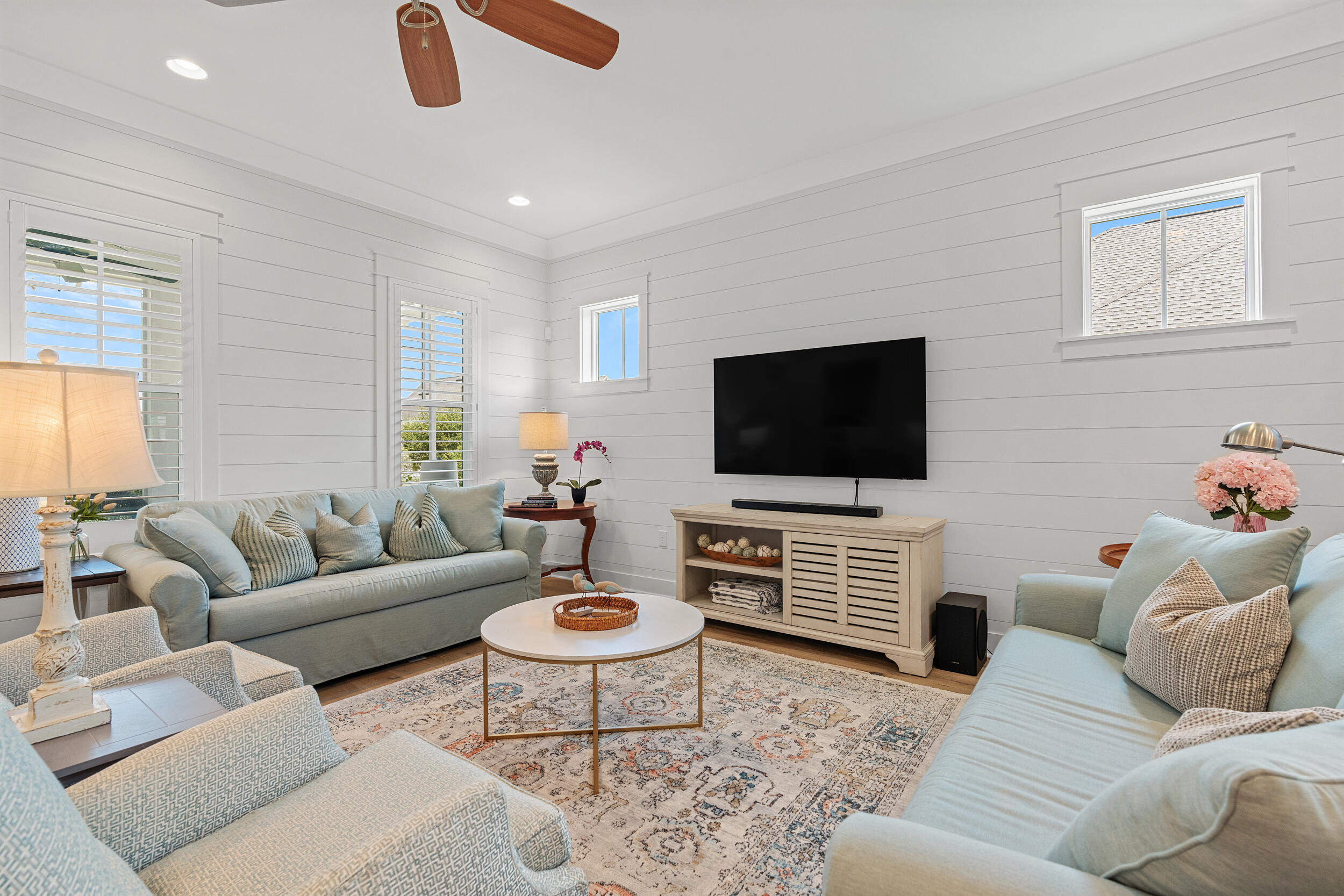 170 Sidecamp Road, Unit LOT 85 Watersound, FL 32461 - Photo 8 of 54 a living room with furniture and a flat screen tv