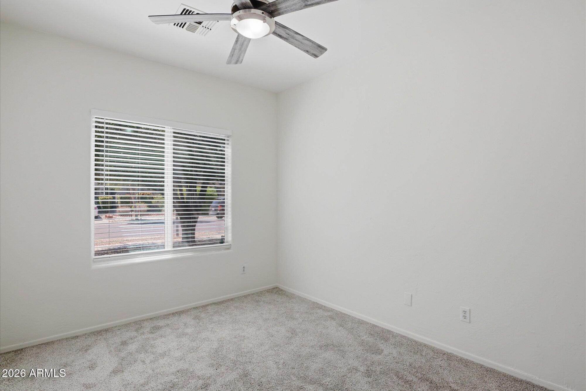 8838 West Payson Road Tolleson, AZ 85353 - Photo 17 of 22 an empty room with a window