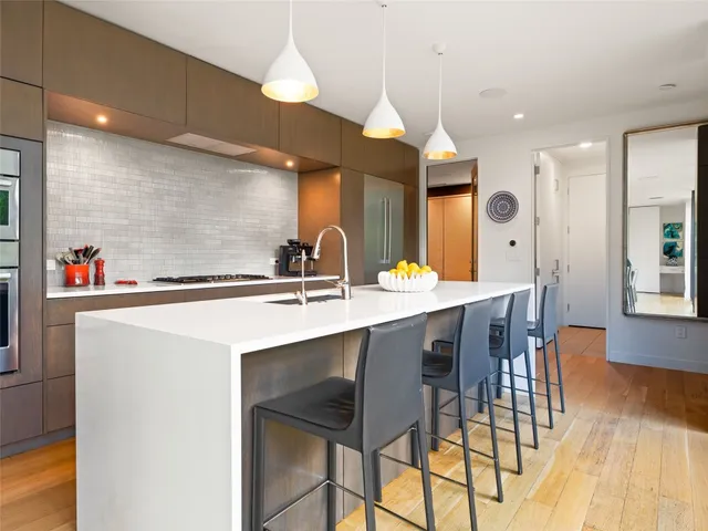 a kitchen with a sink cabinets and window