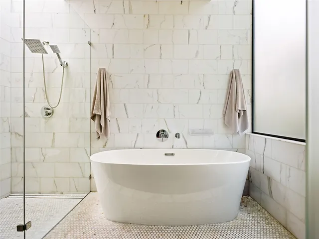 a white bath tub sitting in a bathroom