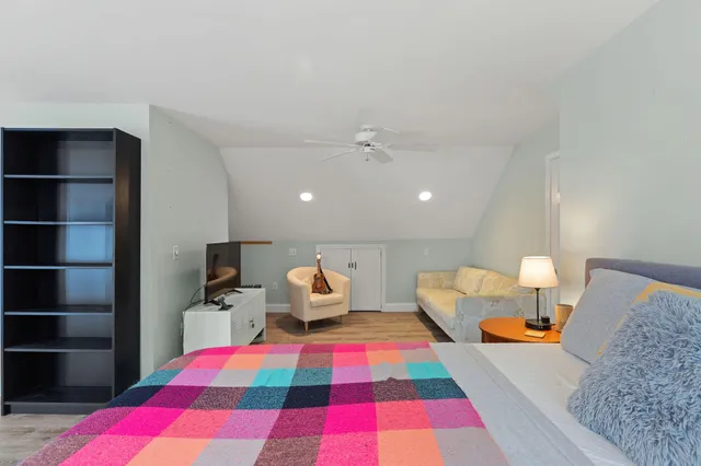 a very nice looking room with a large window and a mirror