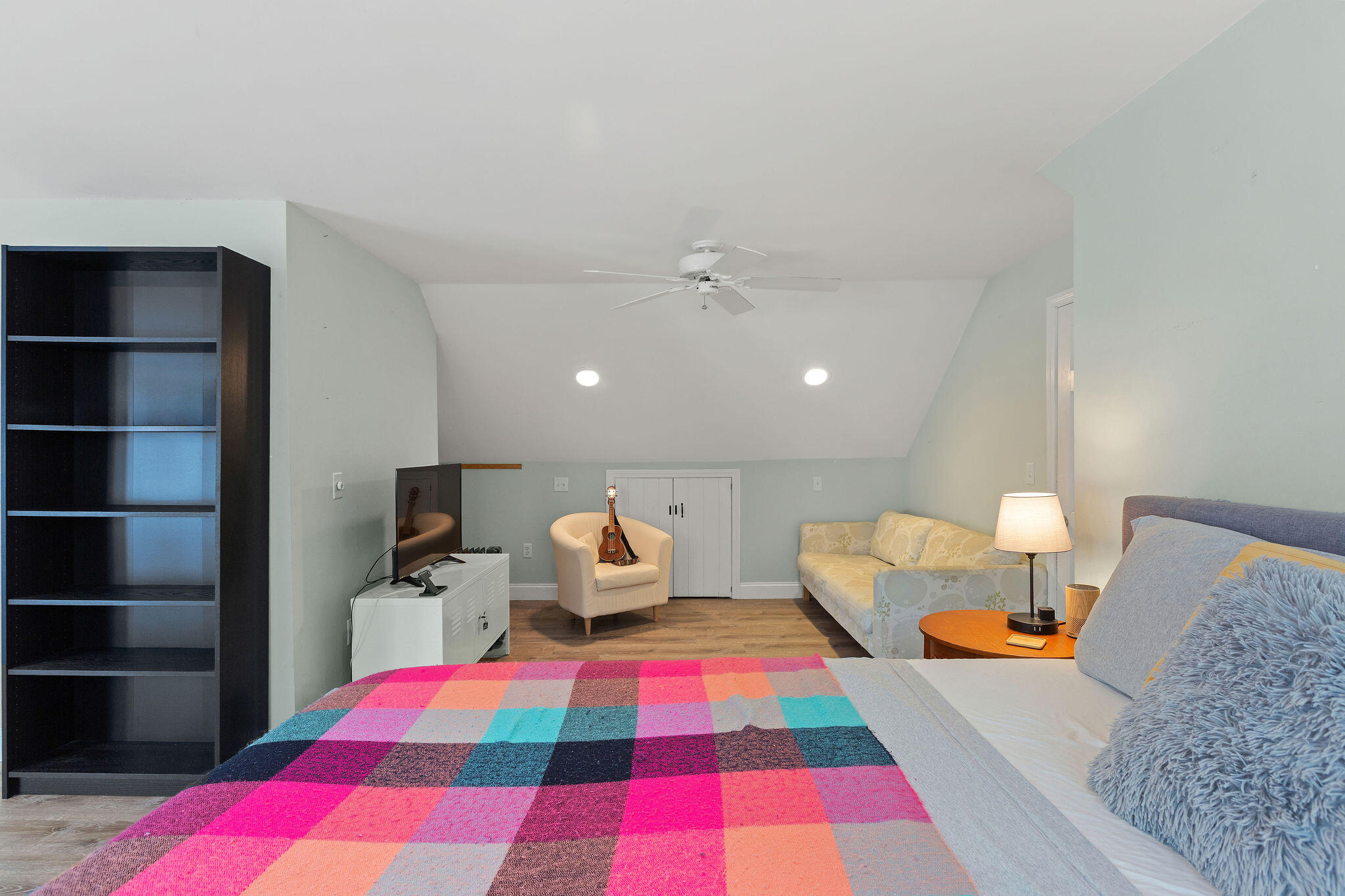 274 Commons Way Brewster, MA 02631 - Photo 14 of 32 a bedroom with a bed and wooden floor