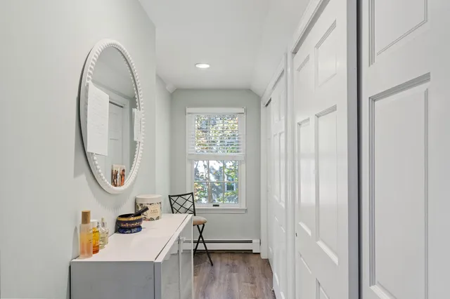 a spacious bathroom with a double vanity sink a mirror and a bathtub