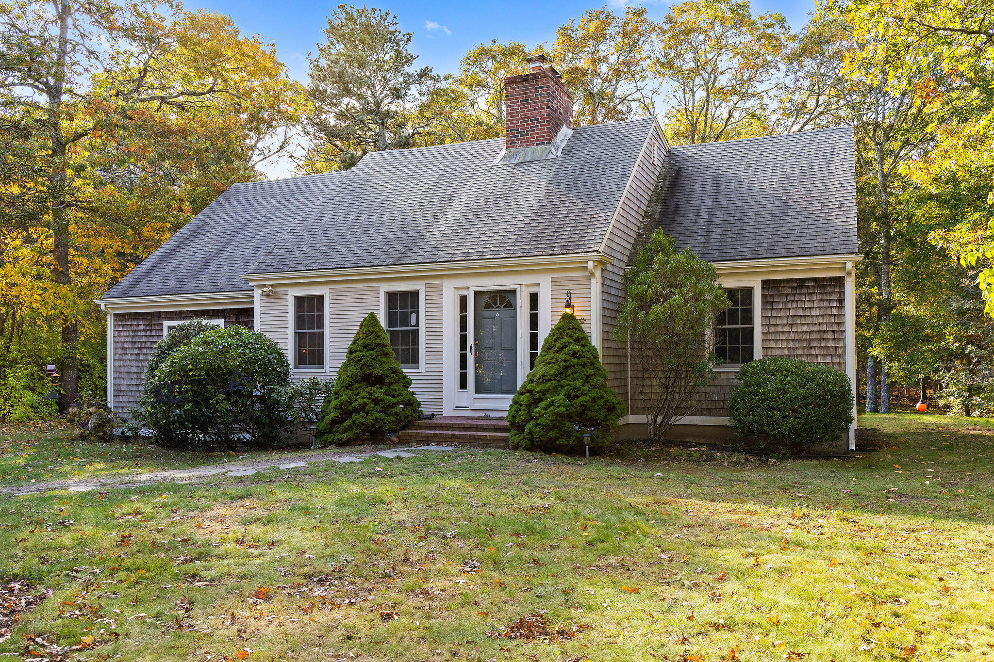 274 Commons Way Brewster, MA 02631 - Photo 2 of 32 a view of house with garden and tall tree