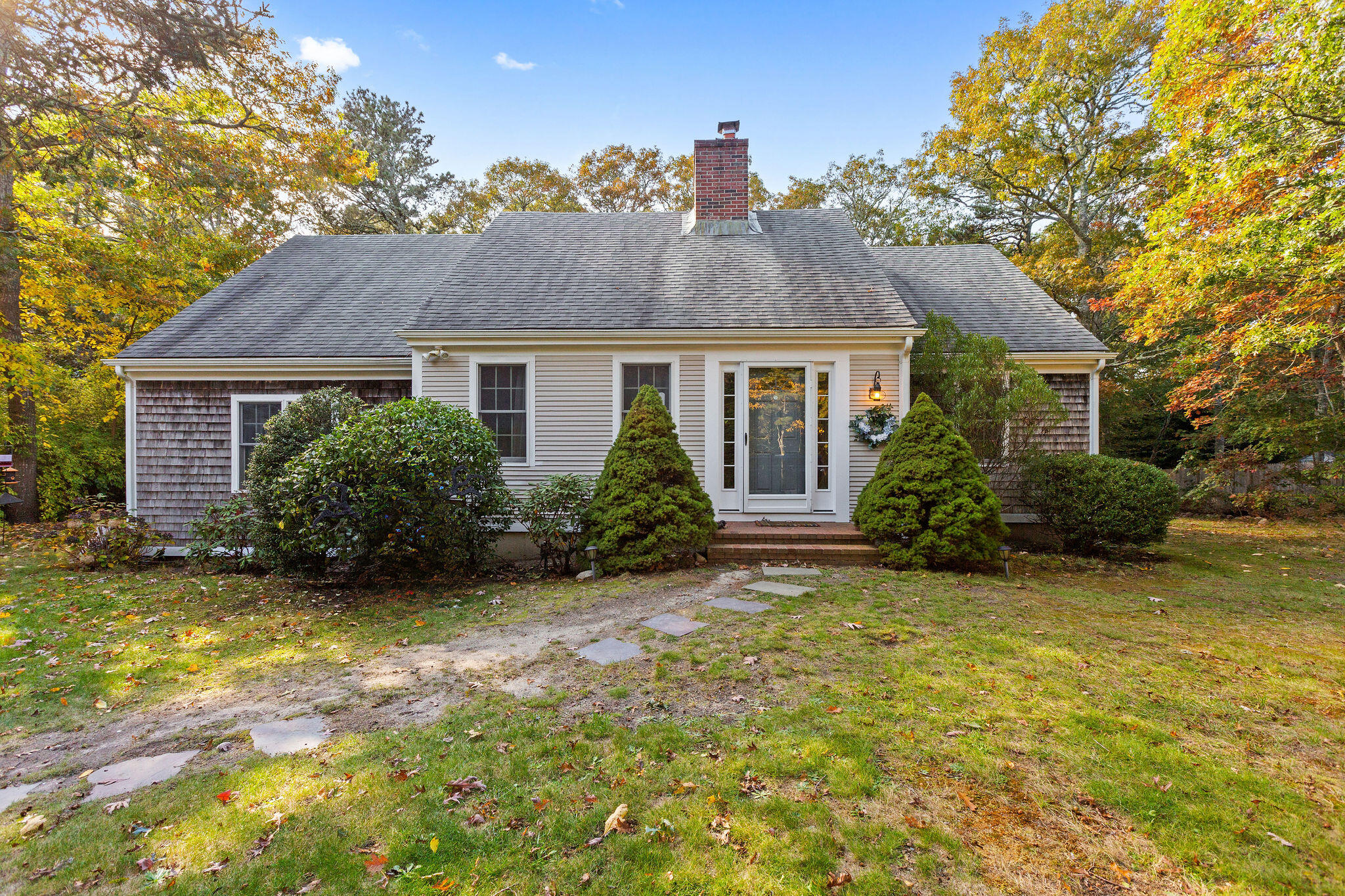 274 Commons Way Brewster, MA 02631 - Photo 22 of 32 a house view with a garden space