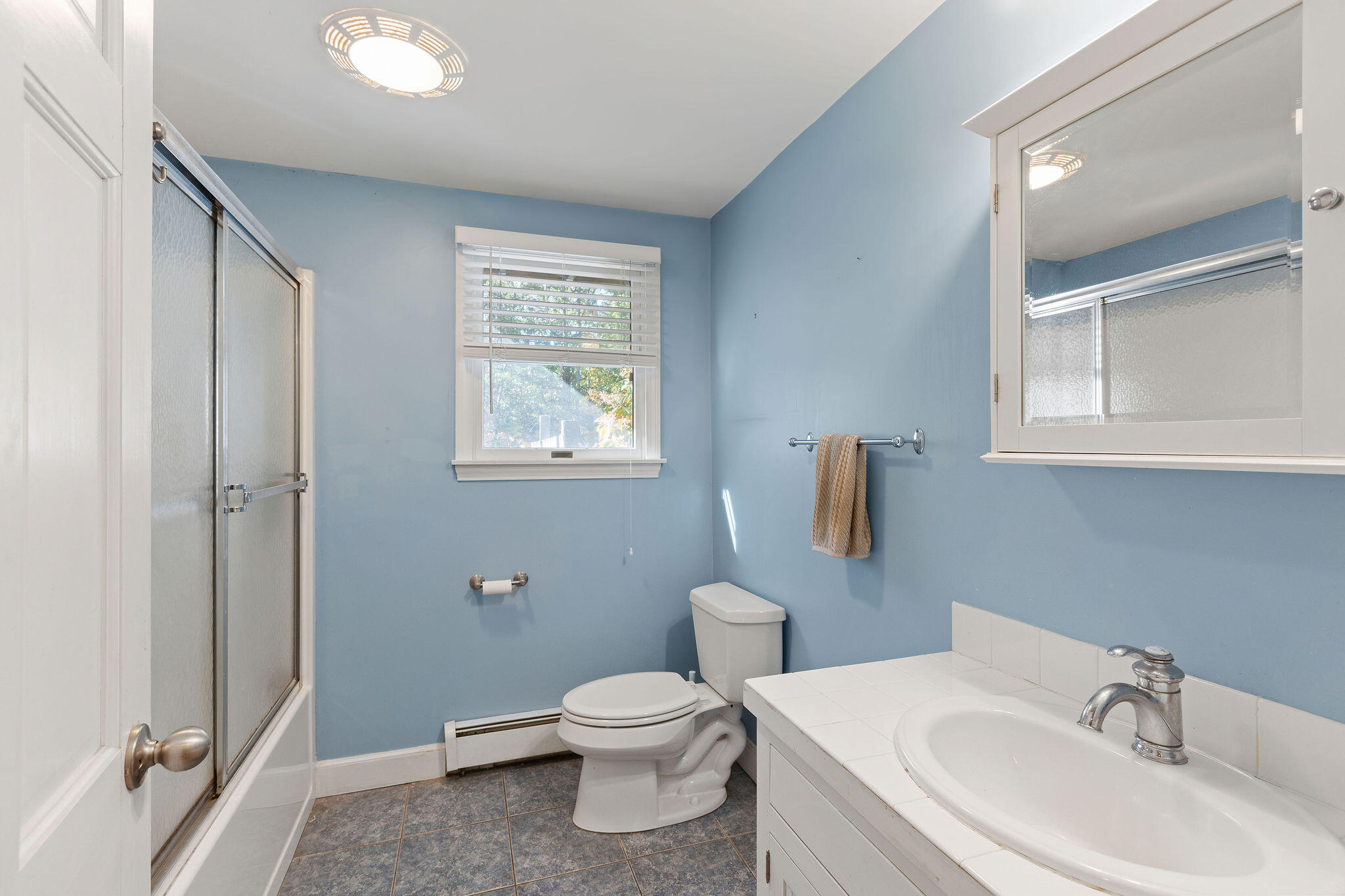 274 Commons Way Brewster, MA 02631 - Photo 23 of 32 a bathroom with a toilet a sink and mirror