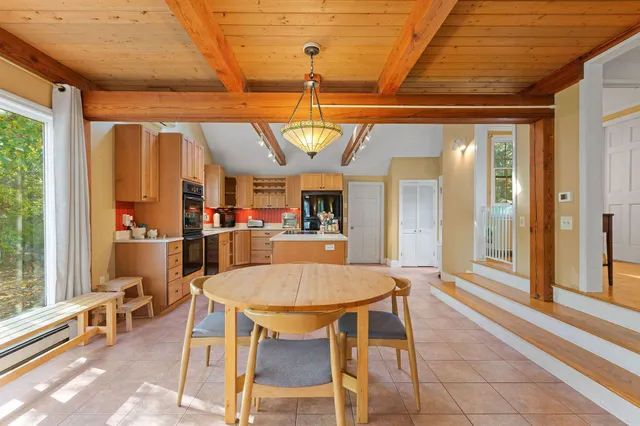 a dining room with furniture and window