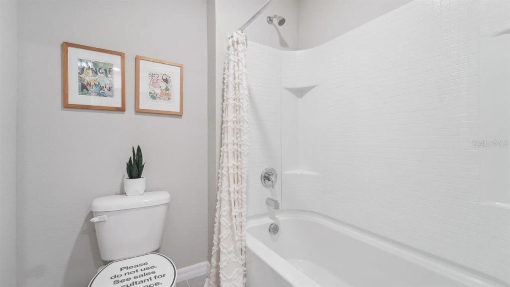 17493 Acorn Drop Road Land O Lakes, FL 34638 - Photo 8 of 23 a bathroom with a bathtub and a toilet