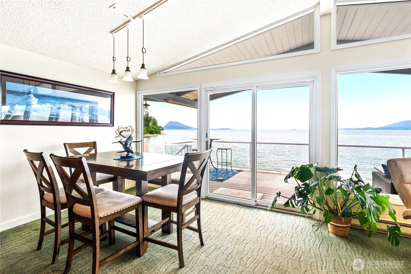 9609 Samish Island Road Bow, WA 98232 - Photo 8 of 33 a view of a dining room with furniture window and wooden floor