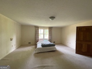 1478 Mineral Springs Road Elberton, GA 30635 - Photo 13 of 30 a spacious bedroom with a bed and a window