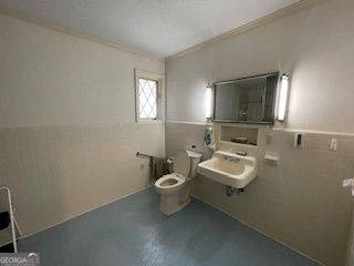 1478 Mineral Springs Road Elberton, GA 30635 - Photo 15 of 30 a bathroom with a toilet sink and mirror