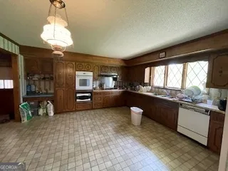 a kitchen with a sink and a refrigerator