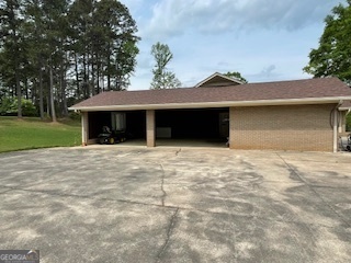 1478 Mineral Springs Road Elberton, GA 30635 - Photo 22 of 30 a front view of a house with a yard and garage