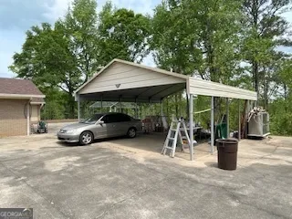 a view of a patio with table and chairs and potted plants