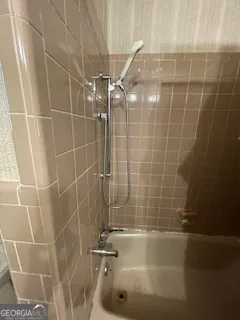 a bathroom with a toilet sink and shower