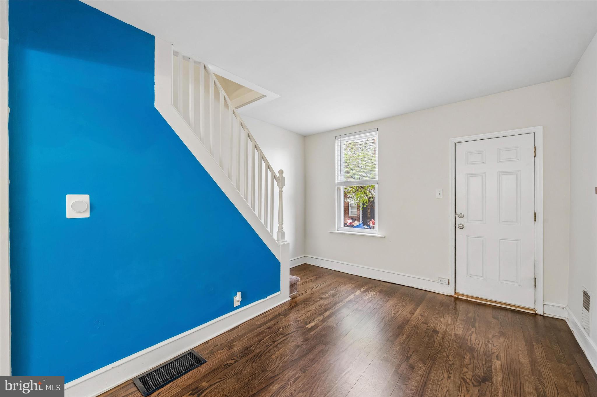 2531 Webb Street Philadelphia, PA 19125 - Photo 4 of 15 a view of a hallway with wooden floor and staircase