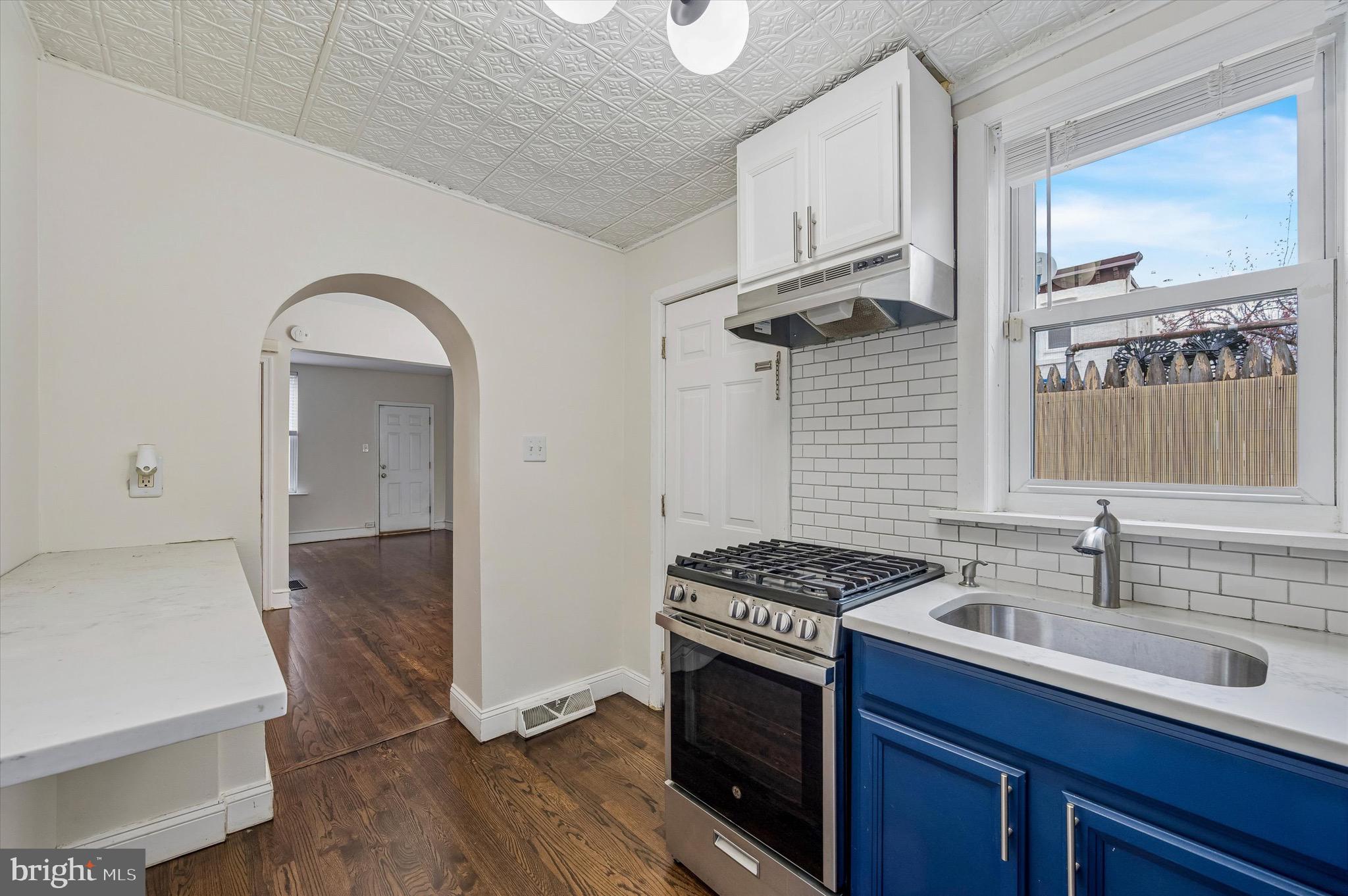 2531 Webb Street Philadelphia, PA 19125 - Photo 10 of 15 a kitchen with stainless steel appliances granite countertop a sink stove and cabinets