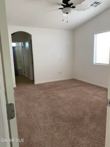 an empty room with a mirror