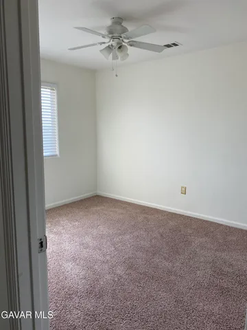 a view of a big room with carpet