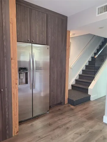 a view of entryway with wooden floor