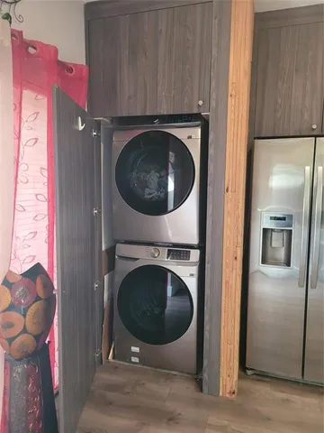 a view of a kitchen with a washer and dryer