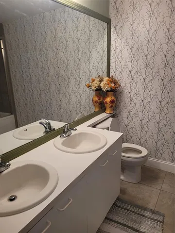 a bathroom with a sink and a toilet