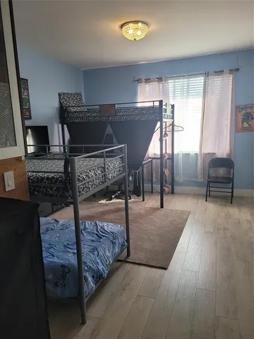 a bedroom with furniture and window