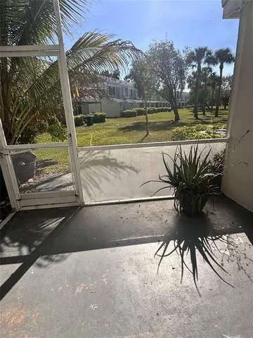 a view of a swimming pool with a table and chairs