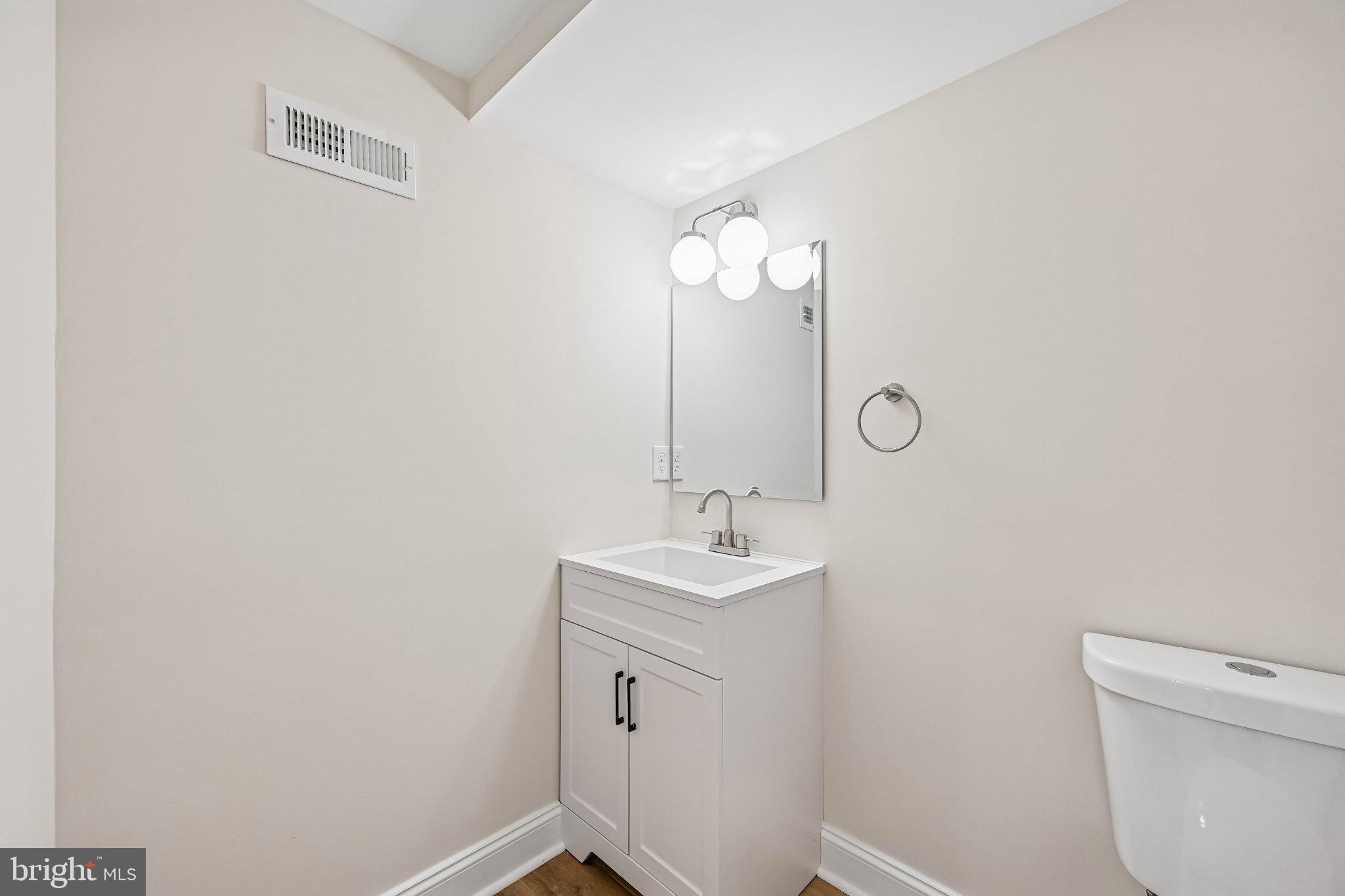 5714 Rusk Avenue Baltimore, MD 21215 - Photo 39 of 51 Sleek and modern bathroom oasis.