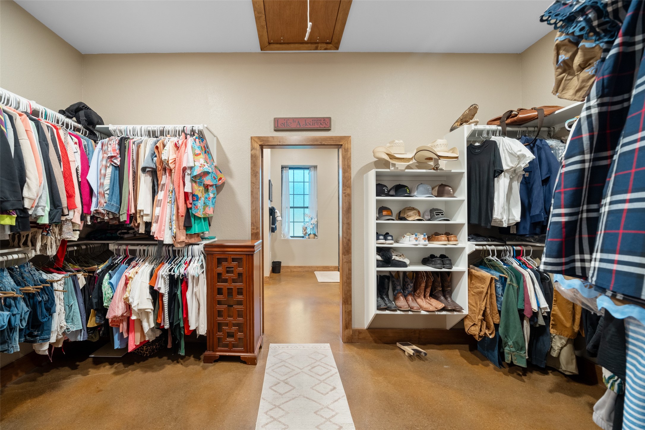 1402 Eagle Ferry Road Anahuac, TX 77514 - Photo 34 of 48 a view of walk in closet with clothes and shoes
