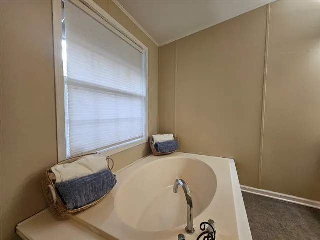 a front view of a house with yard patio and fire pit