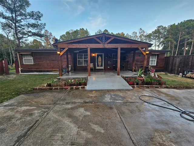a view of a house with potted plants
