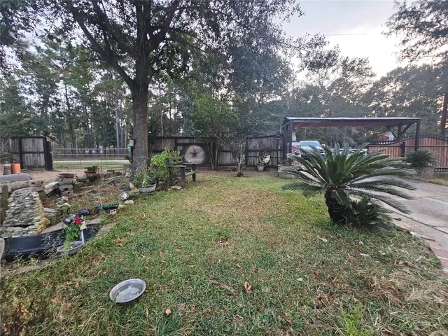 a view of a car park in front of a house
