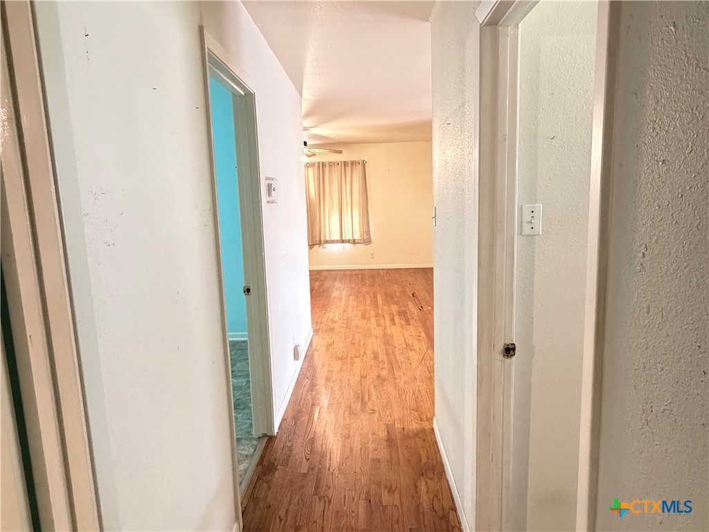1902 Navidad Street Victoria, TX 77901 - Photo 16 of 23 a view of a hallway with wooden floor